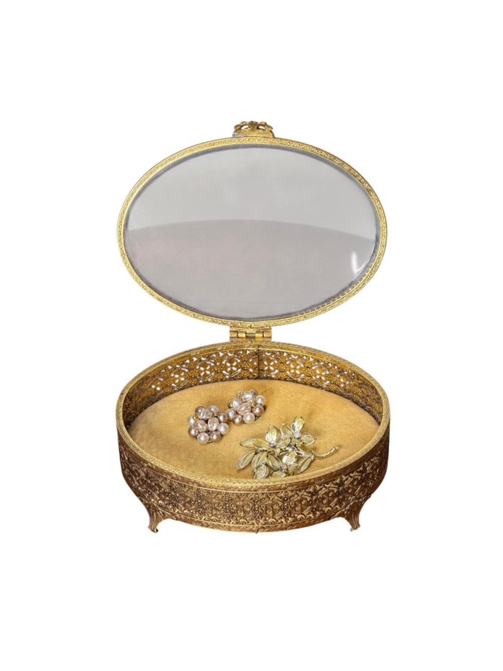 Vintage Hollywood Regency style brass filigree jewelry box with beveled glass to